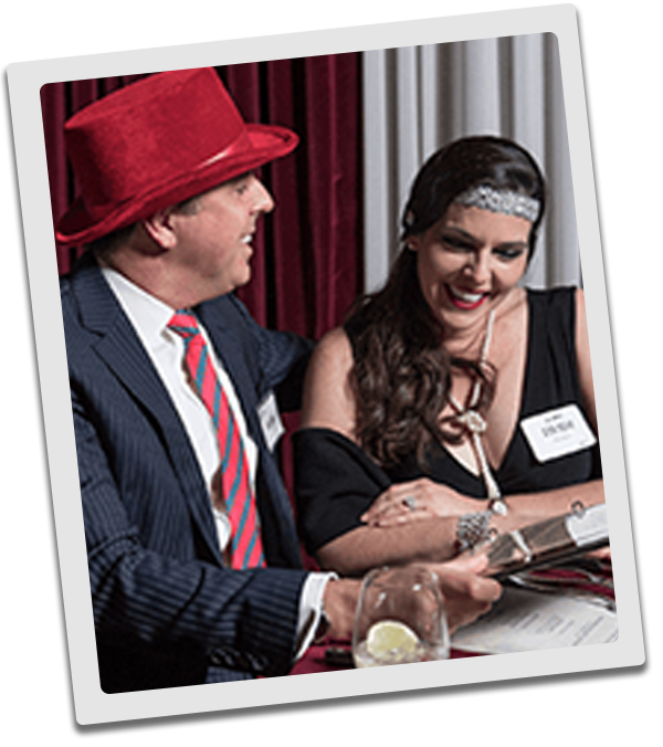 Kansas City Murder Mystery couple checking out the dinner menu